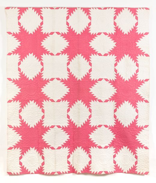 Pink and white feathered star quilt