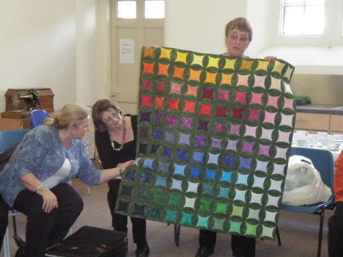 Local quilter Shirley shares her quilt with the group